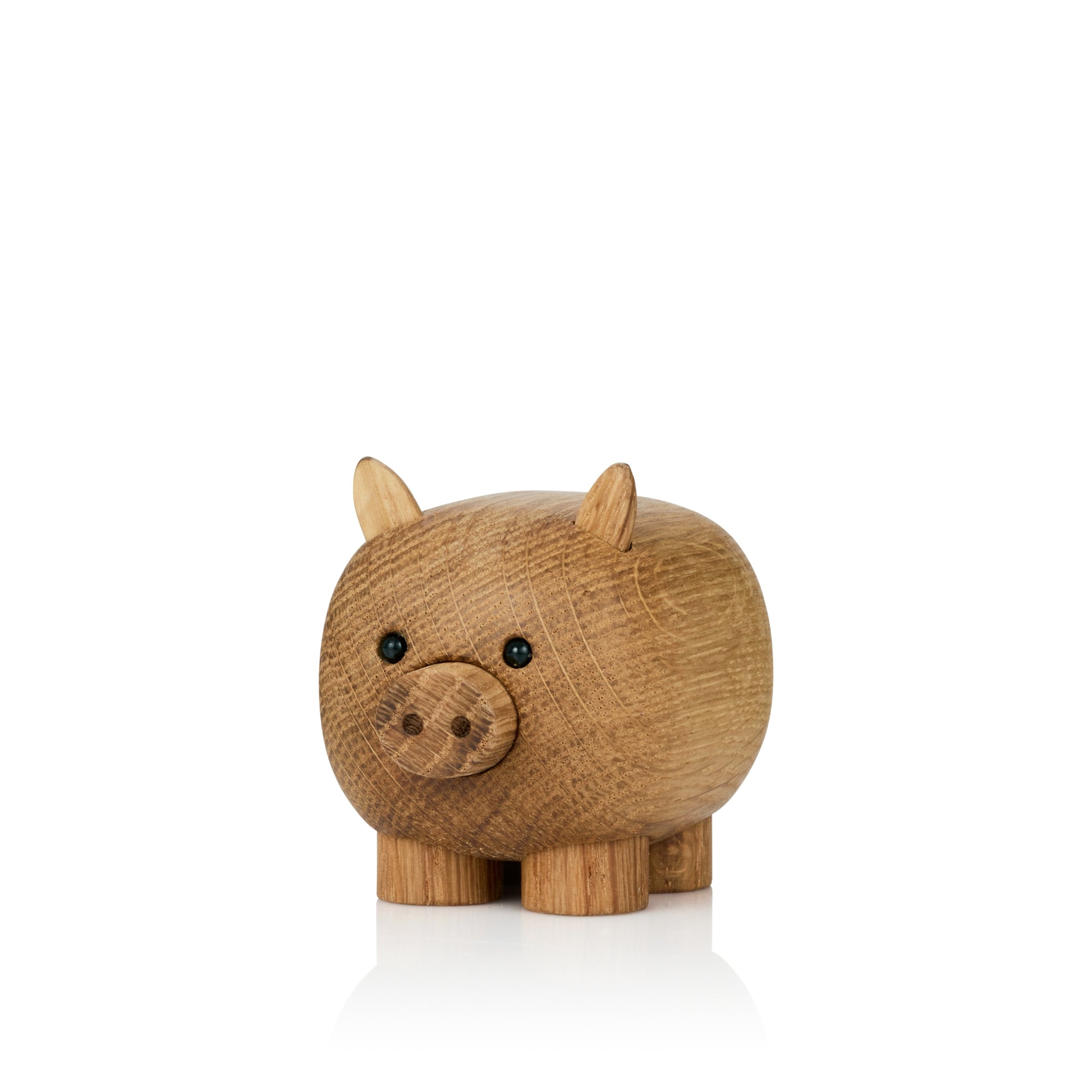 A wooden pig figurine with small ears and round black eyes.