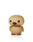 A small, round wooden figure with a smooth finish and simple features.