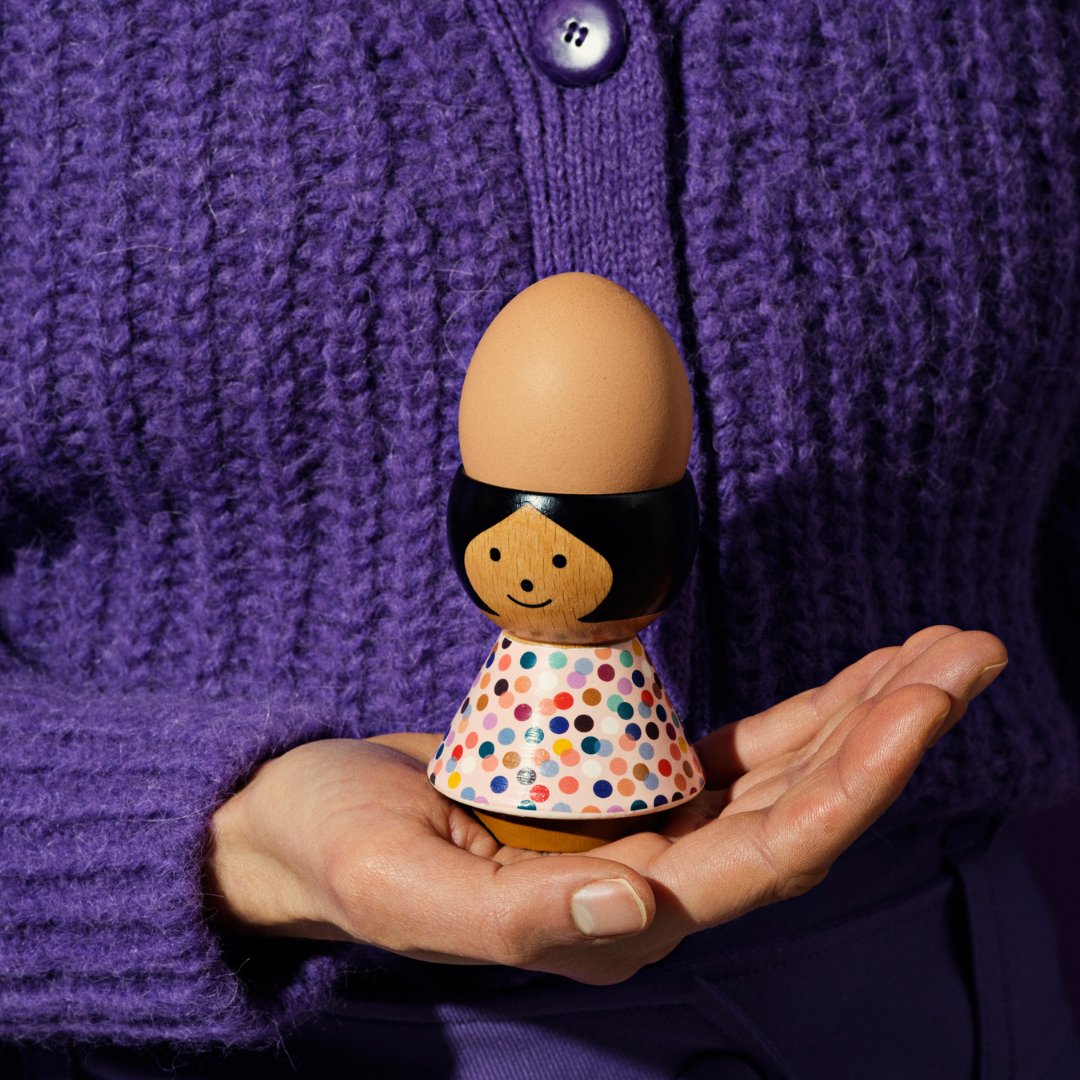 Lucie Kaas&#39; Poppy Egg Holder being held in a hand