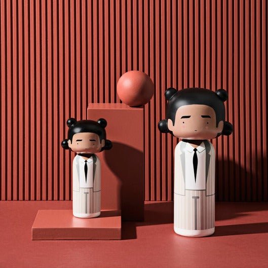 Lucie Kaas&#39; Jean Michel Basquiat Three-point-crown Kokeshi Doll in two sizes on red background