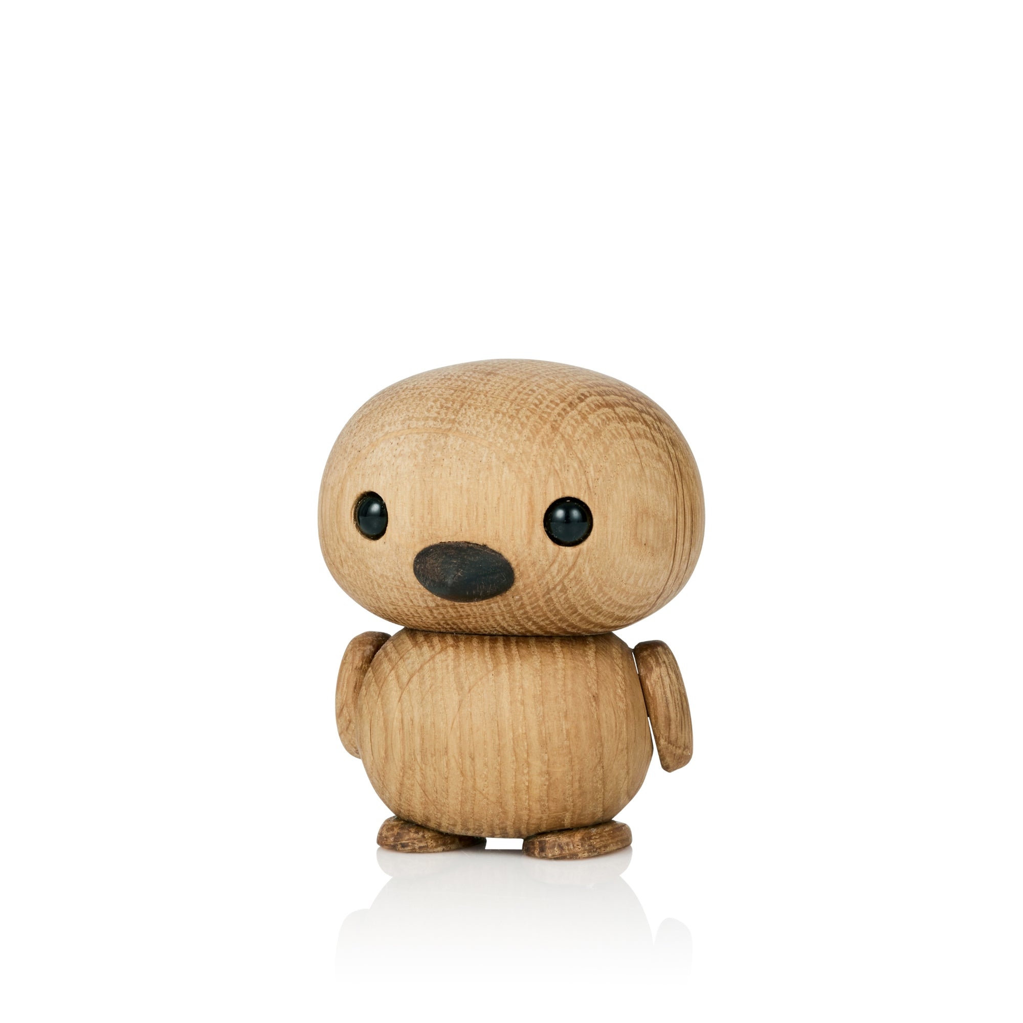 Eine kleine, runde Holzfigur mit glatter Oberfläche und einfachen Merkmalen.