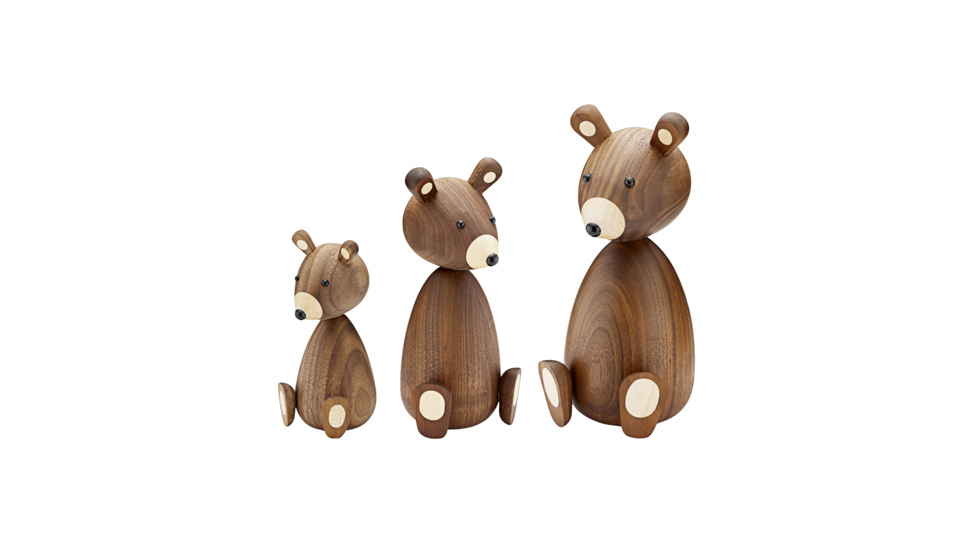 Drei unterschiedlich große Bärenfiguren aus Holz, jeweils mit glatter Oberfläche und einfachen Merkmalen.