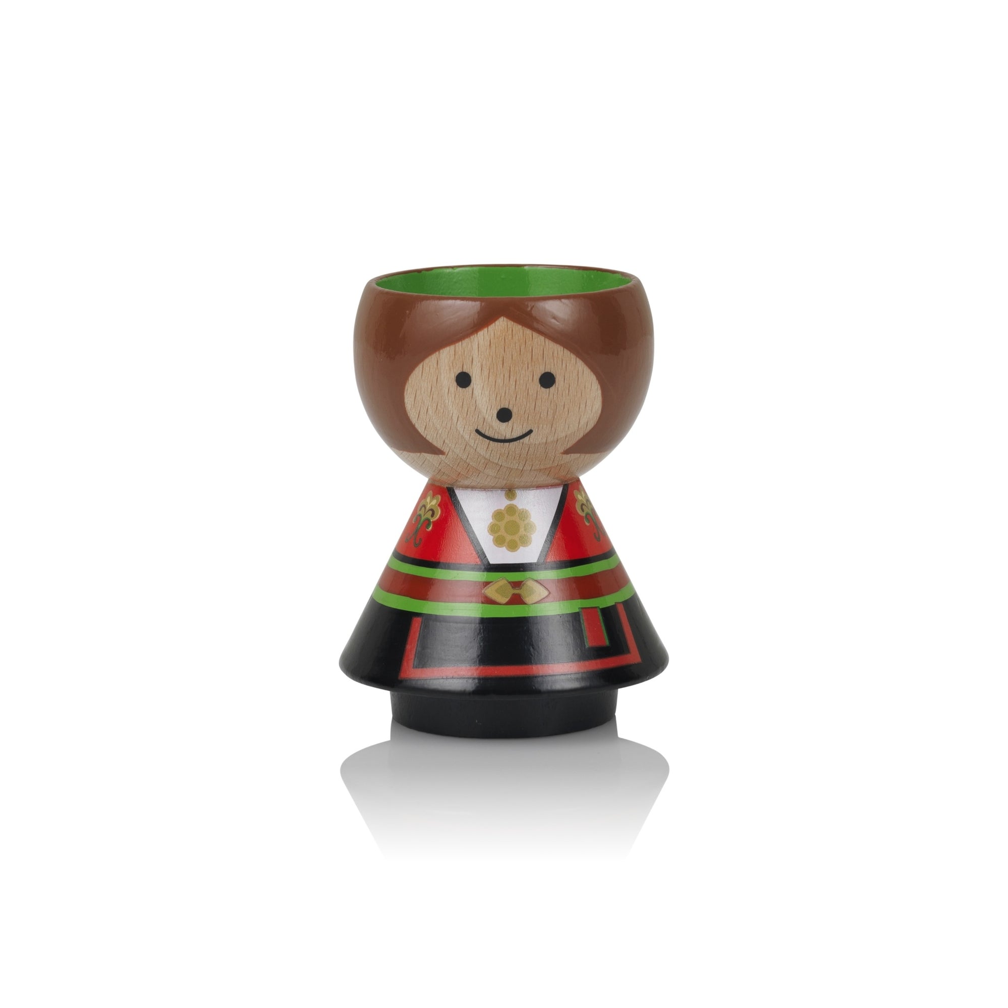 Poupée kokeshi en bois avec une robe rouge et noire, un visage souriant et un intérieur vert.