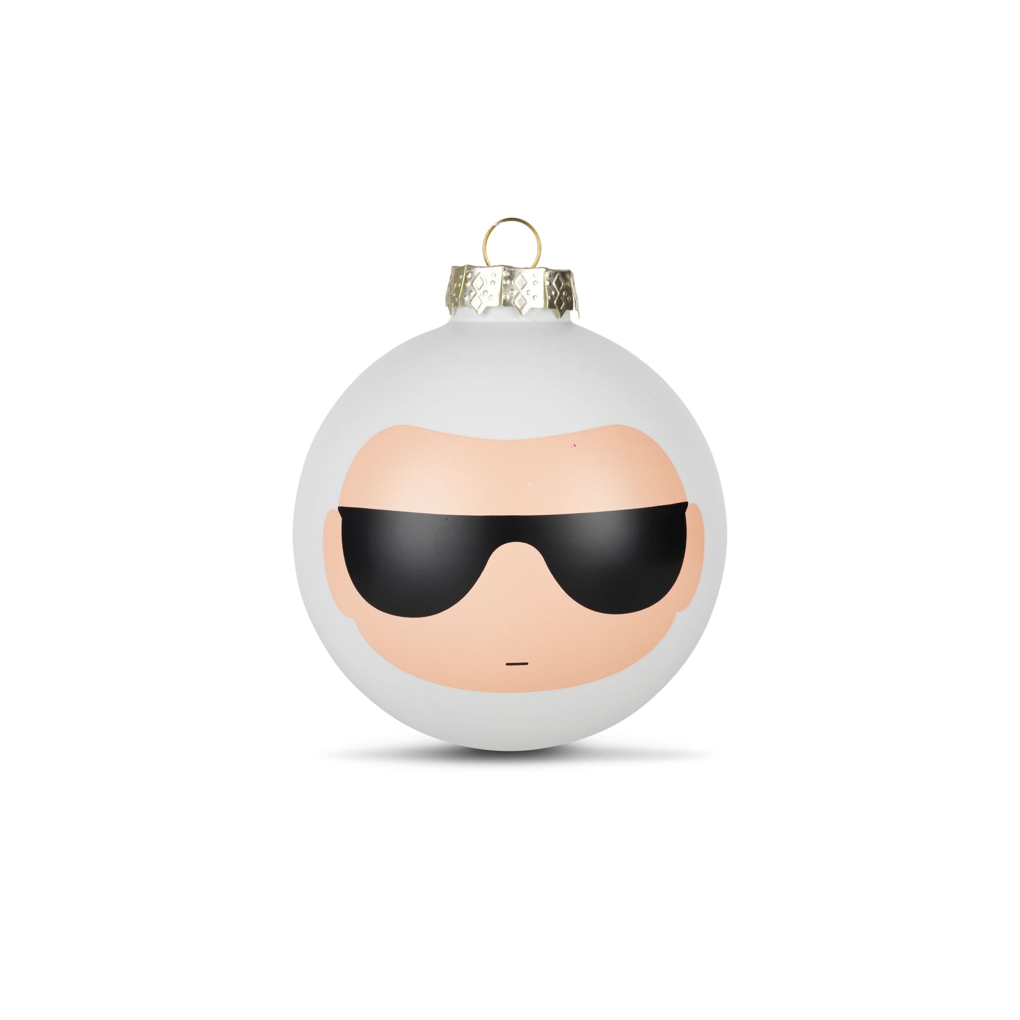 A white Christmas ornament with a minimalist face design wearing black sunglasses.