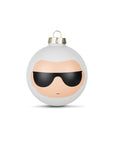 A white Christmas ornament with a minimalist face design wearing black sunglasses.