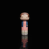 Lucie Kaas kokeshi doll of Eleven from Stranger Things wearing pink dress and blue jacket