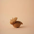 Lucie Kaas wooden triceratops toy, minimalist carved oak dinosaur with three horns and black eye