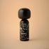 Lucie Kaas black kokeshi doll with white skull doodle and "Evil Thoughts" lettering, matte finish