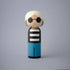 Lucie Kaas kokeshi doll with white hair, black round sunglasses, black striped top and blue pants