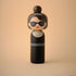Lucie Kaas kokeshi doll of Audrey Hepburn in Breakfast at Tiffany's black dress and sunglasses