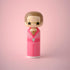 Lucie Kaas kokeshi doll in pink glittery jumpsuit with star-shaped sunglasses, glam performer style