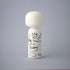 Lucie Kaas white kokeshi doll with black skull doodle, crown and Evil Thoughts text, minimalist design