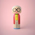 Lucie Kaas kokeshi doll of a stylish older woman with white hair, round glasses and green beads