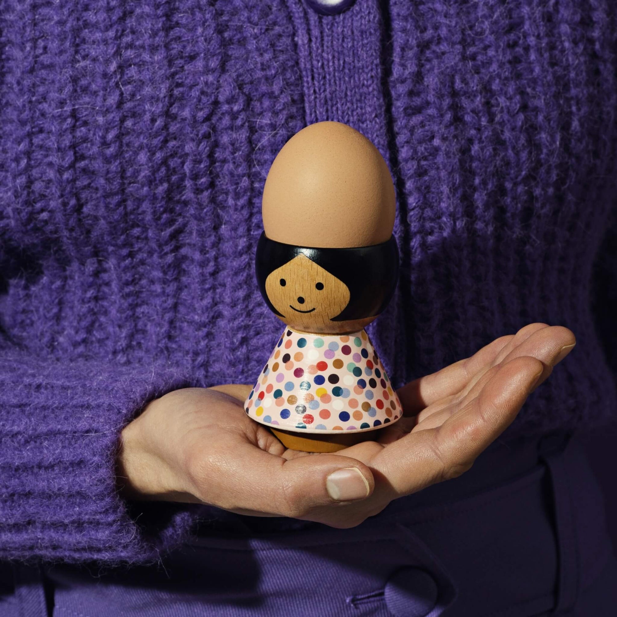 Lucie Kaas&#39; Poppy Egg Holder being held in a hand