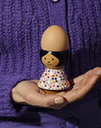 Lucie Kaas' Poppy Egg Holder being held in a hand