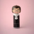 Lucie Kaas wooden kokeshi doll in judge robe with lace collar and round glasses