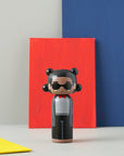 Jean-Michel Basquiat Kokeshi doll on a multi colored background